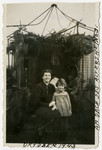 Edith Heller and her daughter Ruth pose outside their Sukkah.