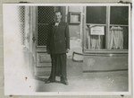 Salo Bratman stands in front of a building, probably after the war.