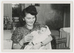 Anna Rosenzweig holds her baby daughter Faye.