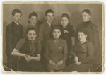 Group portrait of young adult members of the Rosenzweig family in prewar Sosnowiec and probably their friends

Anna Genzels is pictured in the center and David Rosenzweig is standing behind her.