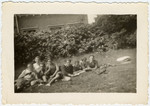 Belgian Jewish youth relax on the grounds of La Ramee, an agricultural training school.
