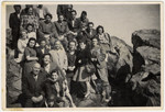 A large group of Jewish displaced persons goes on an excursion in the rocky countryside near Frankfurt.