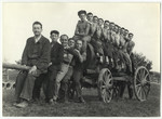 A group of Jewish workers pose atop a wagon in the Lipa farm labor camp.