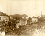 American forces load their weapons and prepare for action in an unidentified town.