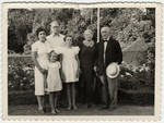 Group portrait of a Latvian Jewish family.

Photographed are Frieda and Arthur Lewenstein with their daughters Libin (left) and Bella (right), and Frieda's parents Bernard and Scheine ('Jenny') Brenner.