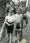 A Jewish family walks down a street in Bialystok.