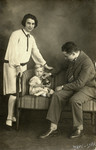 Studio portrait of Hennie and Yehoshua Birnbaum and their baby daughter Sonni.