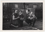 Valerie, Cary and Ernest Lowe pose outside their home in Branau where Ernest was working for American counter-intelligence

The previous occupant had been a German general.