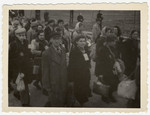 Jewish police escort a column of Jews to an assembly point in the Lodz ghetto.