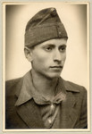 Studio portrait of Marcel Kuttner wearing a military cap.