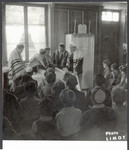 Young people read from the Torah in a religious service in a postwar OSE children's home.