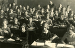Children sit at their desks in the Carlebach School in Leipzig, Germany.
