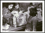 A group of girls builds a doll house in a postwar OSE children's home.
