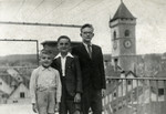 Shimon, Leon and Hanoch Zeidenbach pose outside the children's home in Switzerland after fleeing to safety.