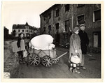 German civilians move to new quarters after their own had been damaged beyond repair.