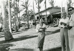 A Filipino woman carries a basket of food.  

Dr.