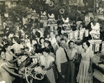 Saul and Erna Cassel (bottom right) work in the Berg department store.