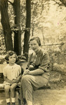 Margot Cassel sits next to her mother Erna on a park bench in Breslau, following her mother's return from a sanatorium.