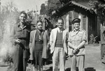 Maurice and Esther Weeg pose for a photograph with two British officers while in India.