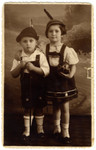 Studio portrait of Aaron and Ruth Friedman wearing Alpine garb crocheted by their mother.