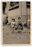 Ruth and Aharon Friedman play outside their home in prewar Mukachevo.
