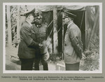 Reichsleiter Alfred Rosenberg and Adolf Hitler confer at military headquarters.