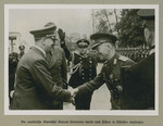 Adolf Hitler shakes hands with Prime Minister of Romania Ion Antonescu.
