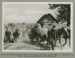 Peasants with wagons and livestock proceed down a dirt road.