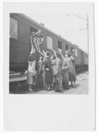 A group of Jewish displaced persons gather at the train station in Salzburg to say goodbye to their friends.