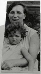 Hilda Wiener Rattner holds her daughter, Lilly, on her lap.