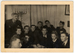 Members of a Zionist group in the Lodz ghetto at a Hanukkah gathering.
