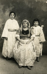 Laurette and Lucienne Moyal pose with their Aunt, during the Jewish holiday of Purim.