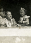 Close-up portrait of a Jewish child with her governess.