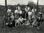 Boys from Korczak's orphanage pose outside on a field.