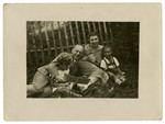 The Mueller family rests on the grass.

Left to right are Suse, Sebald, Laura and Norbert Mueller.