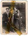 A group of Jewish youths pose next to a fence.

Among those pictured are Sruleck Slomnicki (far left) and Zigmund Weinrib, a photographer (second from the left).