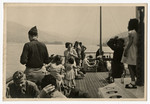 American soldiers and civilians enjoy an excursion on Hitler's yacht.