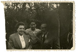 Simon Steil poses with the Mr. and Mrs. Finel, cousins of his mother who had escaped to Switzerland and spent the war there.