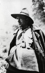 Close-up portrait of Leo Cohn carrying a blanket and wearing his Eclaireur Israelite uniform.