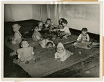 Orphans, found by U.S. troops in Germany, play in the infant/toddler room of Kloster Indersdorf.