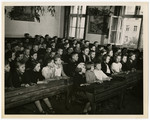 Polish children attend school in a displaced persons camp

Original caption reads: 
Allies Speed Repatriation of Displaced Persons Inside Germany
Liberated by the Allied armies in Germany, more than four million men, women and children, former slaves of the Nazi war machine, are free to return to their native lands as soon as repatriation machinery makes it possible.