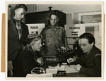 A Swiss woman speaks with a United Nations Relief and Rehabilitation Administration member about her capture and servitude during the Nazi Regime.