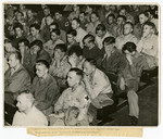 German prisoners of war are forced to watch an atrocity  film on German concentration camps.