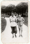 Two Jewish friends walk down a path in a park in Fascist Romania.