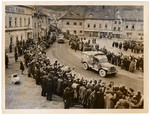 Czech civilians cheer American soldiers.

Original Caption: "Civilians of Schuttenhoffen, Czechoslovakia, line up to cheer the entrance of Fourth Armored Division forces of the Third US Army, who liberated their town from the Germans.