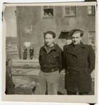 Willy Bogler (right) and a friend pose in front of the entrance to their home at the kibbutz hachshara in Eschwege.