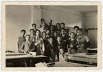 Students at the American College in Bulgaria, a private high school in Sofia, pose for a group photograph in the woodshop.