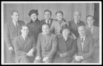 Group portrait of members of the Cultural Committee of the Fuerstenfeldbruck displaced persons' camp.