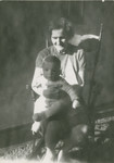 Portrait of Kazimierz Laski's older son, Marek, sitting on the lap of Mrs.