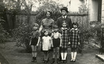 The Birnbaum family poses in a garden while on vacation near Berlin.